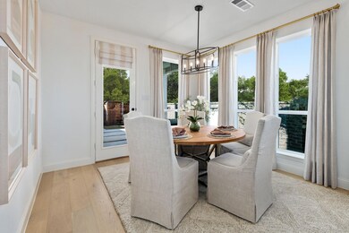 Dining area with light hardwood / wood-style floor