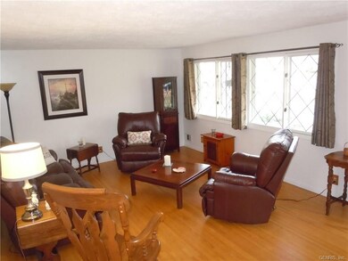SUN FILLED LIVING ROOM WITH BEAUTIFUL HARDWOOD FLO