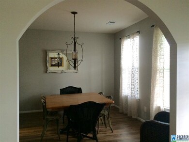 Beautiful arched entry welcomes guests into the fo