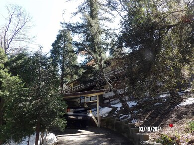 STREET VIEW SHOWING THE COVERED PARKING AREA AND FRONT OF HOME.