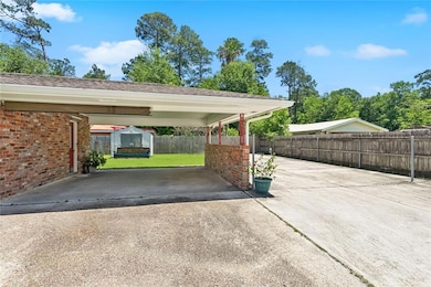 Driveway leading to carport and side door