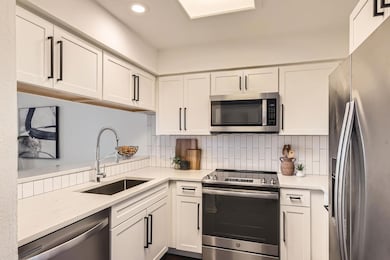 Kitchen featuring appliances with stainless steel