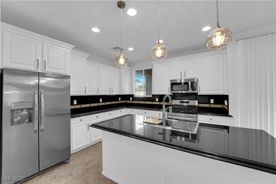 Kitchen featuring appliances with stainless steel