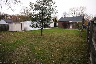 View of yard with a storage shed