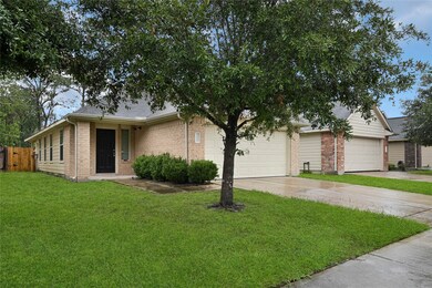 This is a single-story brick home featuring a well