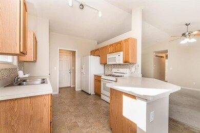 Kitchen w/ backslash and ample amounts of counter 
