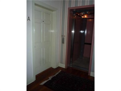 Foyer. 2nd floor foyer showing front door and elev