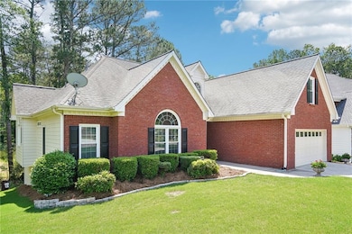 View of front of property with brick siding, a fro