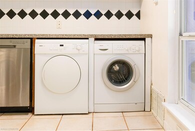 Clothes washing area with washer and dryer and li