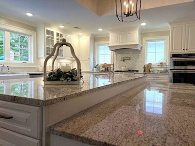 Kitchen with light stone countertops, decorative b