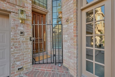 Gated entrance to front door.