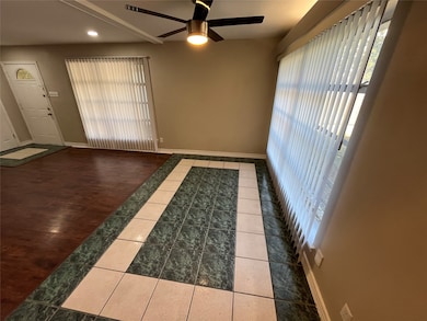 Unfurnished room with tile patterned floors, healthy amount of natural light, ceiling fan, and recessed lighting