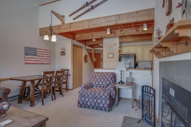 Rustic exposed beam leading into the living area. 