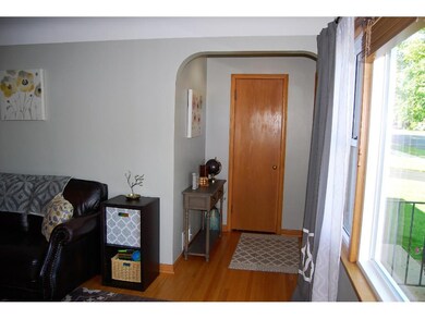 Vintage home features arch entrance & cove living 