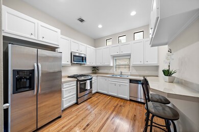 Stainless-steel appliances and ample storage defin