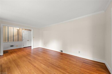 True hardwoods through foyer, living, dining, kitchen.