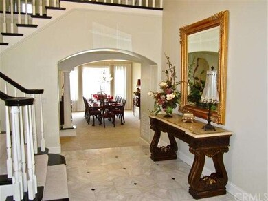 Wide archways, crown moldings, plantation shutters