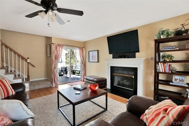 Family Room with Fireplace and entrance to deck.