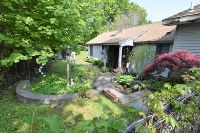 Tastefully Landscaped with Walkway to Rear Yard & 