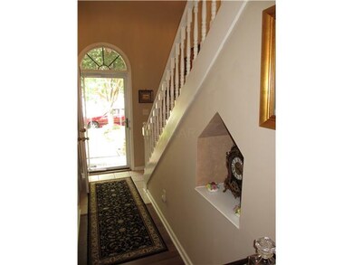 Tile floor in entry and niche to display your trea