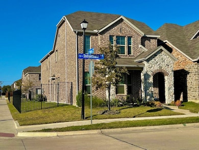 View of front of house with brick siding and stone siding