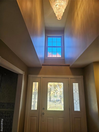 Entryway featuring a chandelier