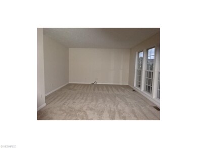 Family room with freshly painted walls and new car