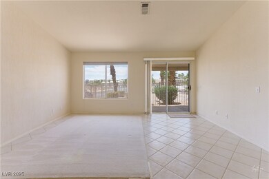 Spare room featuring light tile patterned floors a