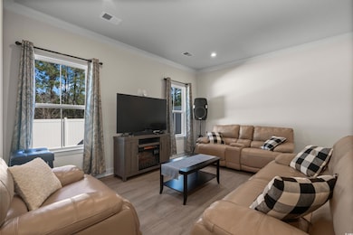 Living room featuring light hardwood / wood-style 