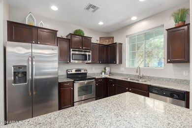 Cherry Cabinets & SS Appliances