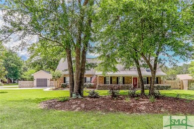 Beautiful front exterior! Mature landscaping, huge porch & shady trees!