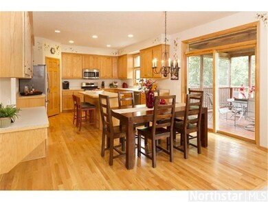 Casual dining area and kitchen with screened porch