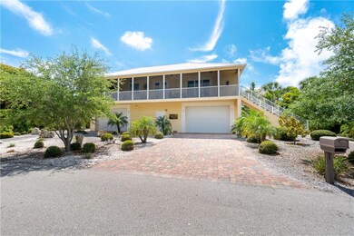 Front of the home. Paver drive and two large garag