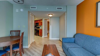Living room with a textured ceiling and light hard