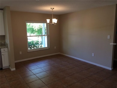 Dining Room Ceramic Floors open to Kitchen. New Li