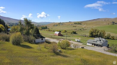 Property view of mountains with a rural view