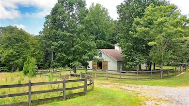 View of yard featuring a view of countryside and an outbuilding