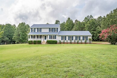 Colonial-style house with a front yard