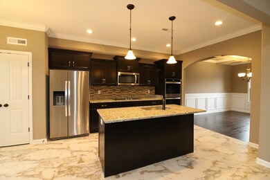 EXAMPLE>>>LARGE Country Kitchen w/ Stainless Steel Appliances (DOUBLE OVEN & COOK TOP), Recessed Lighting, GRANITE Tops, Tile Backsplash, Crown Molding & Tile Flooring!!! SMART DOUBLE OVEN, Preheat right from your phone!! (Refrigerator Not Included!)