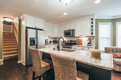 The kitchen & Florida room both have new 5 inch plank hardwood expresso floors.