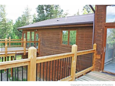 Exterior Back. One Very Large Deck and One off Mas