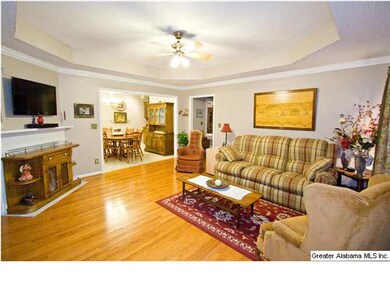 Huge living room with marble fire place.