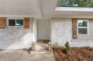 Property entrance with brick siding