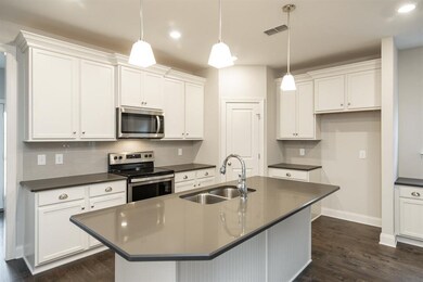 Bright and airy kitchen.  Similar home.