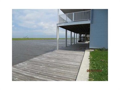 Exterior Back. LEFT SIDE VIEW OF DOWNSTAIRS DECKIN