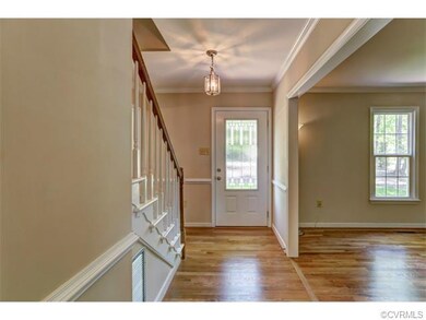 Refinished hardwood floors and new entry door.