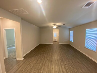 Spare room with dark wood-style floors and a ceil
