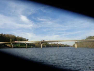 To the right is Iredell County, which is where we are. To the left is Catawba County. There is no development yet on either side of the Catawba County bridge. Keep going straight and you get to the dam. We have not been past River Oaks Landings by boat yet. Will update you in the spring.