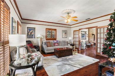 formal living room faces the wide front porch and 