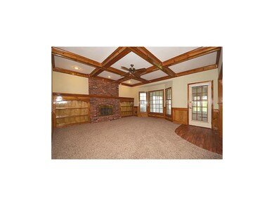 Main floor family room with brick fireplace, built
